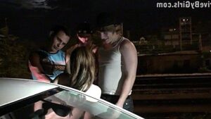 Guys fuck a beauty in the car with the whole crowd